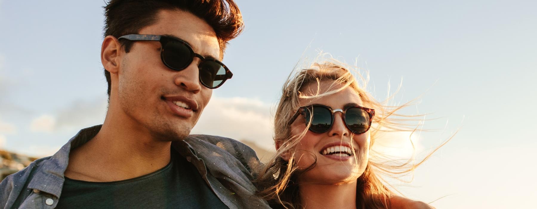 a man and woman wearing sunglasses